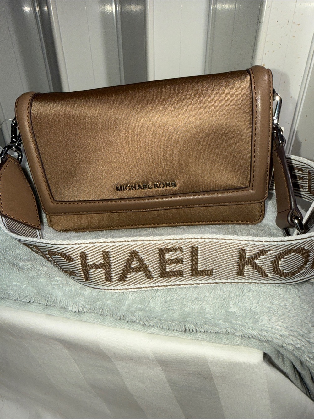 NWT - Michael Kors Metallic Bronze Crossbody with Branded Strap.